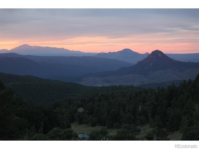 16750 Elk Ridge Road Littleton, CO 80127 - Photo 1 of 25 a view of an mountain and a mountain view