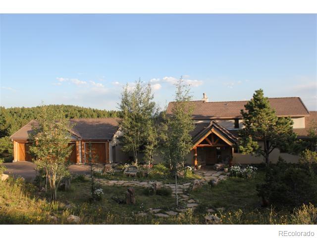 16750 Elk Ridge Road Littleton, CO 80127 - Photo 2 of 25 a view of a house with a yard