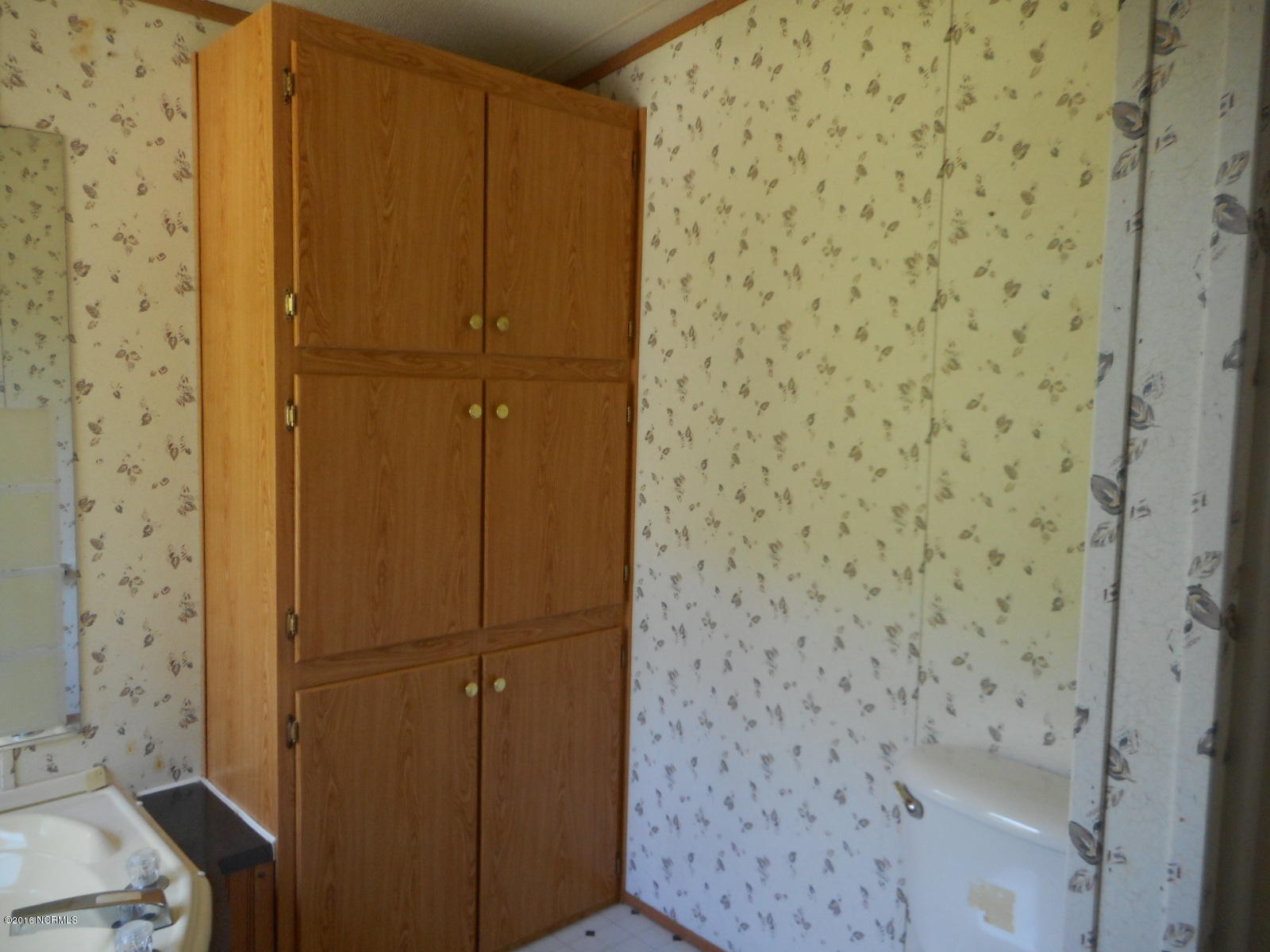 616 Nine Foot Road Newport, NC 28570 - Photo 19 of 46 Bedroom 1 Bath Cabinet
