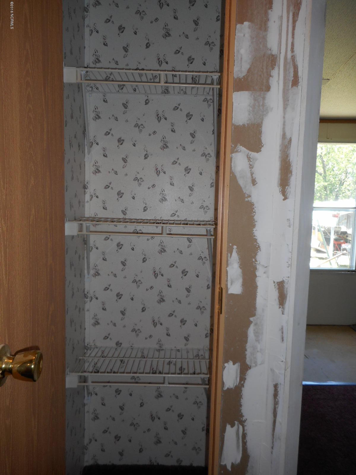616 Nine Foot Road Newport, NC 28570 - Photo 32 of 46 Hall Linen Closet