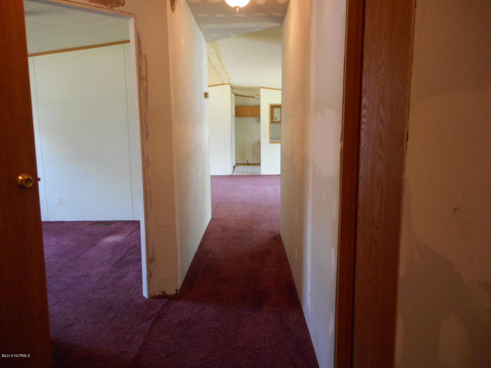 616 Nine Foot Road Newport, NC 28570 - Photo 33 of 46 Hallway to Living Room