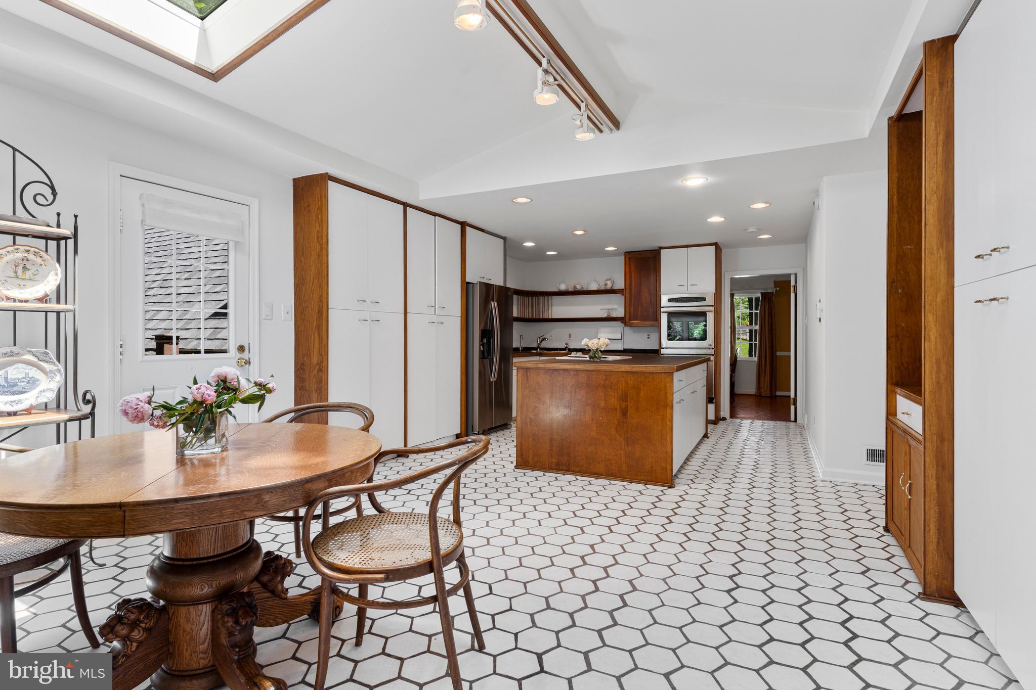 931 Hollow Road Wayne, PA 19087 - Photo 15 of 41 a kitchen with stainless steel appliances kitchen island granite countertop a refrigerator and a stove top oven