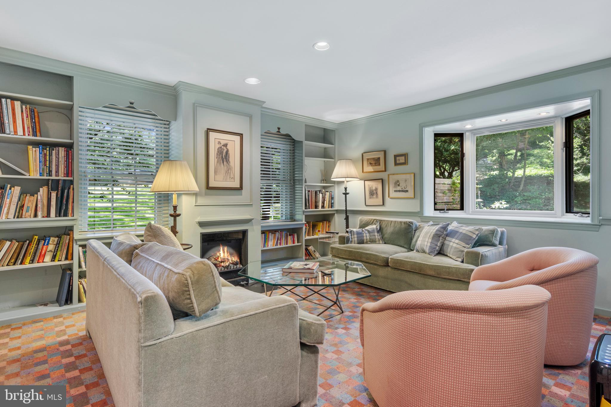 931 Hollow Road Wayne, PA 19087 - Photo 18 of 41 a living room with fireplace furniture and a book shelf