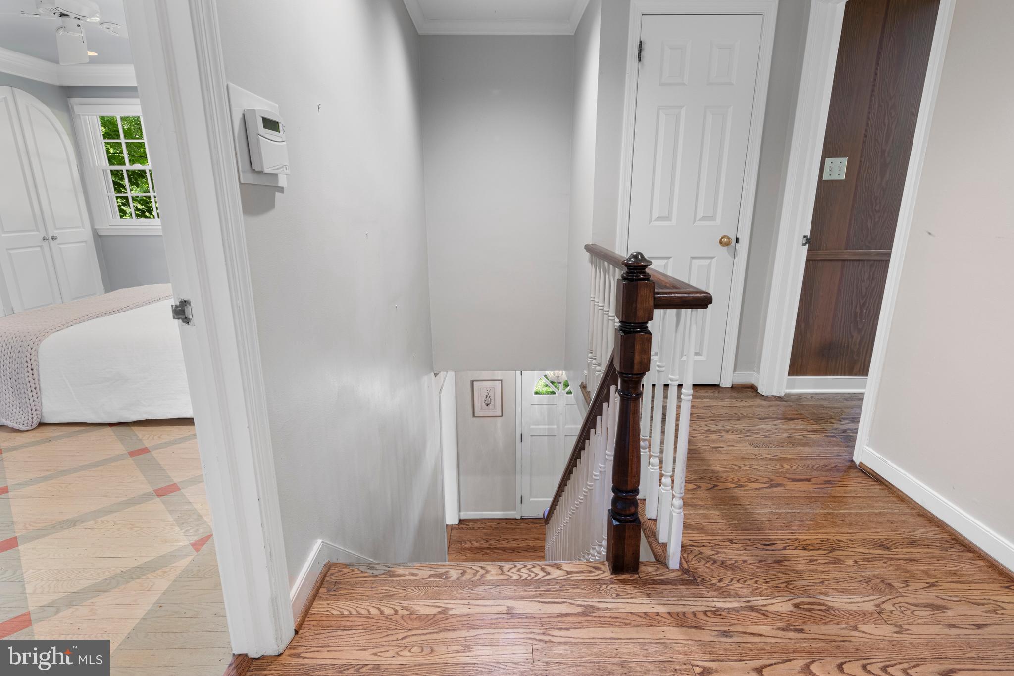 931 Hollow Road Wayne, PA 19087 - Photo 22 of 41 a view of a hallway with wooden floor and staircase