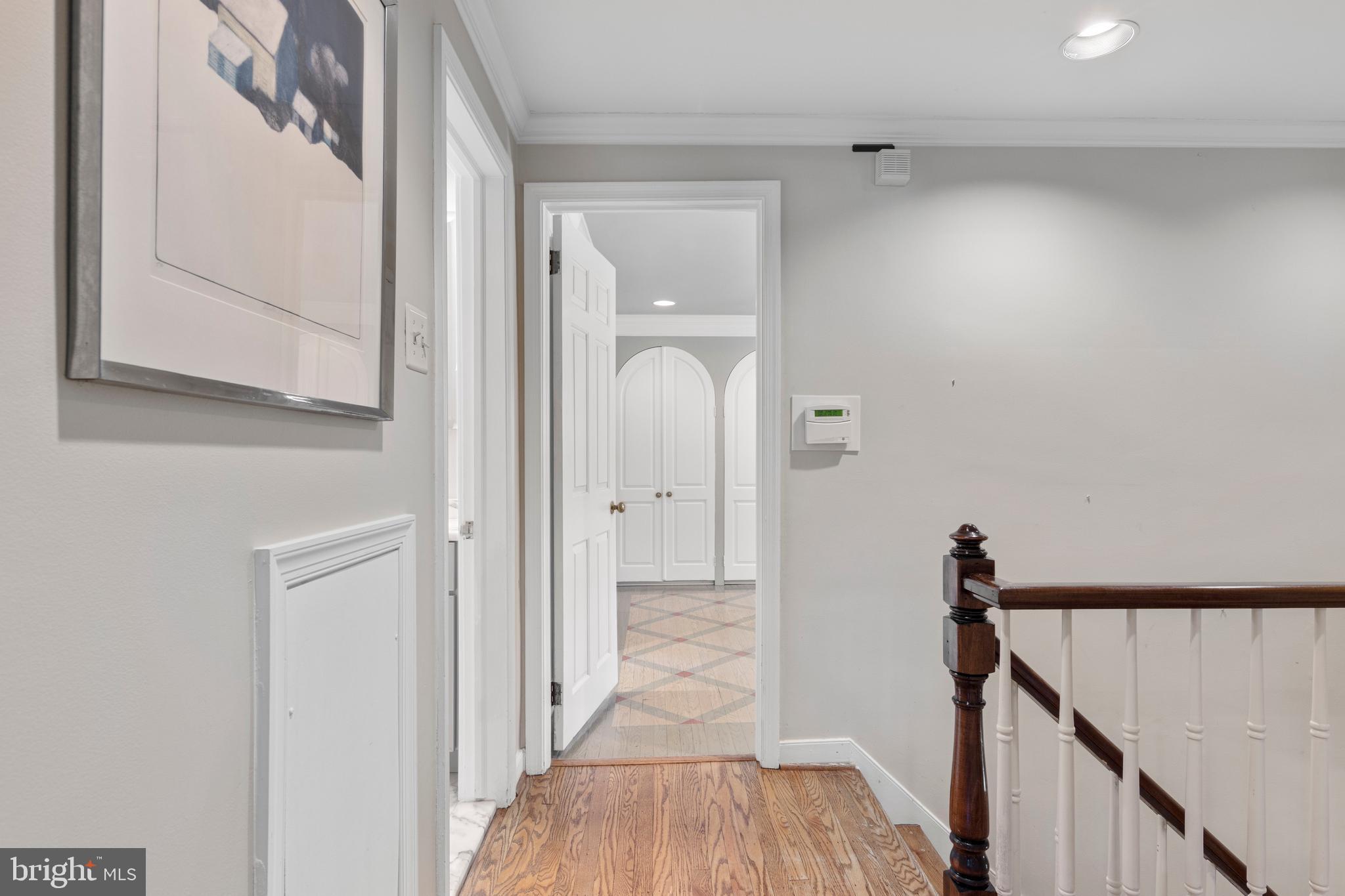 931 Hollow Road Wayne, PA 19087 - Photo 23 of 41 a view of a hallway with wooden floor and staircase