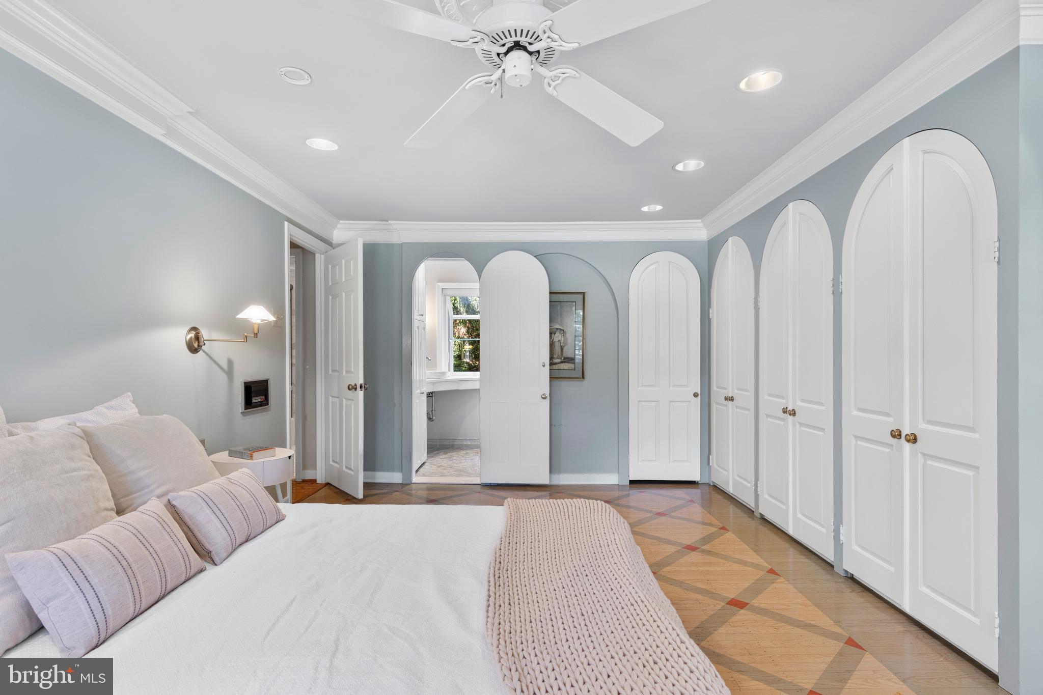 931 Hollow Road Wayne, PA 19087 - Photo 25 of 41 a spacious bedroom with a large bed and chandelier