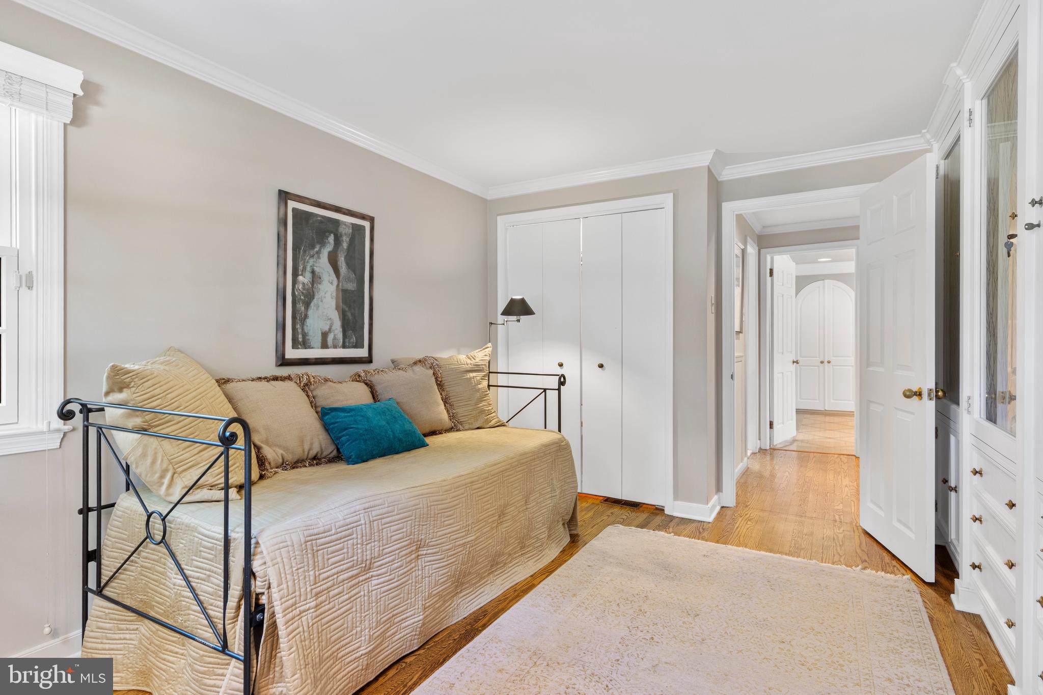 931 Hollow Road Wayne, PA 19087 - Photo 28 of 41 a bedroom with a bed and glass door