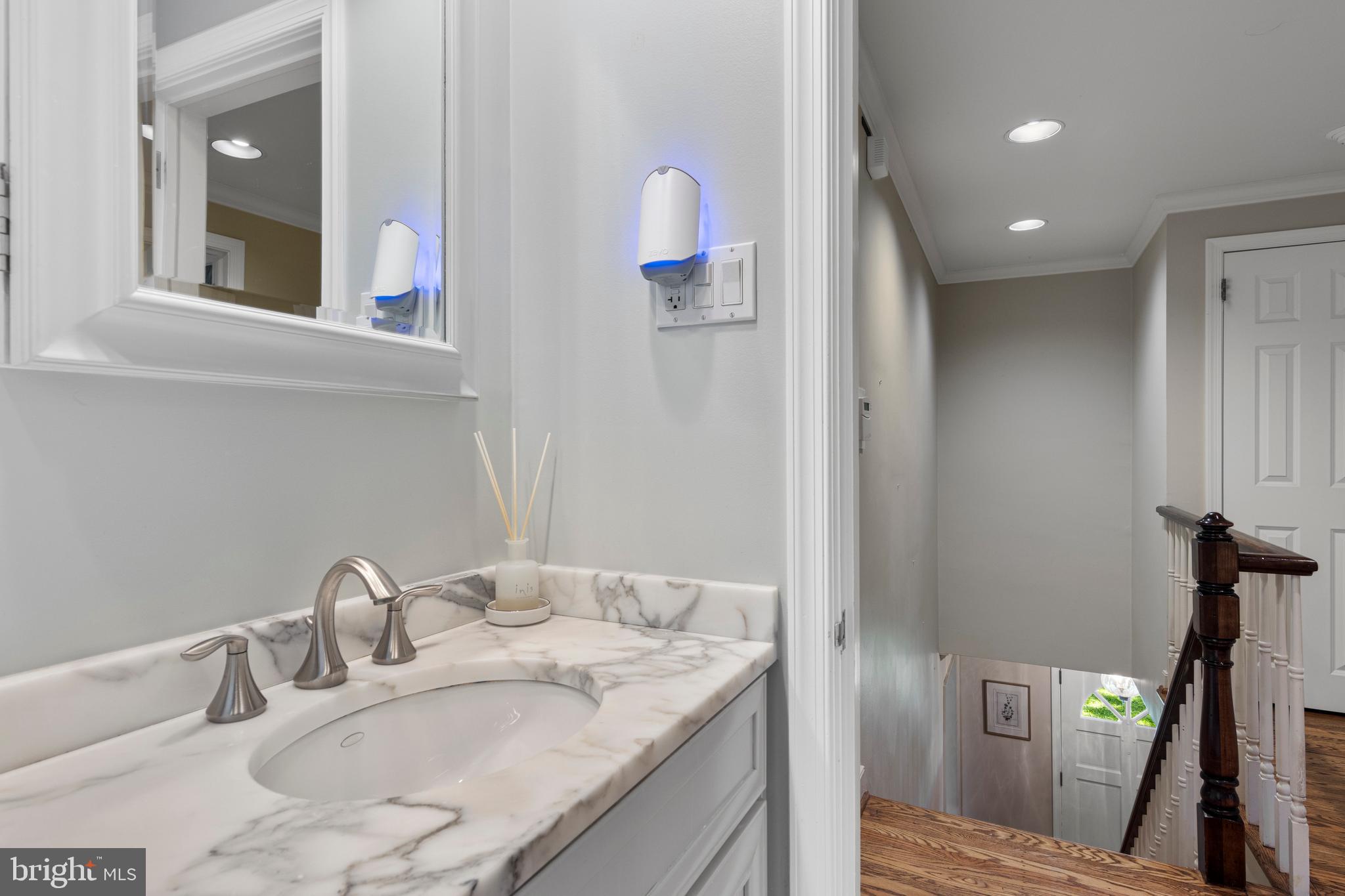 931 Hollow Road Wayne, PA 19087 - Photo 30 of 41 a bathroom with a granite countertop sink a mirror and a shower