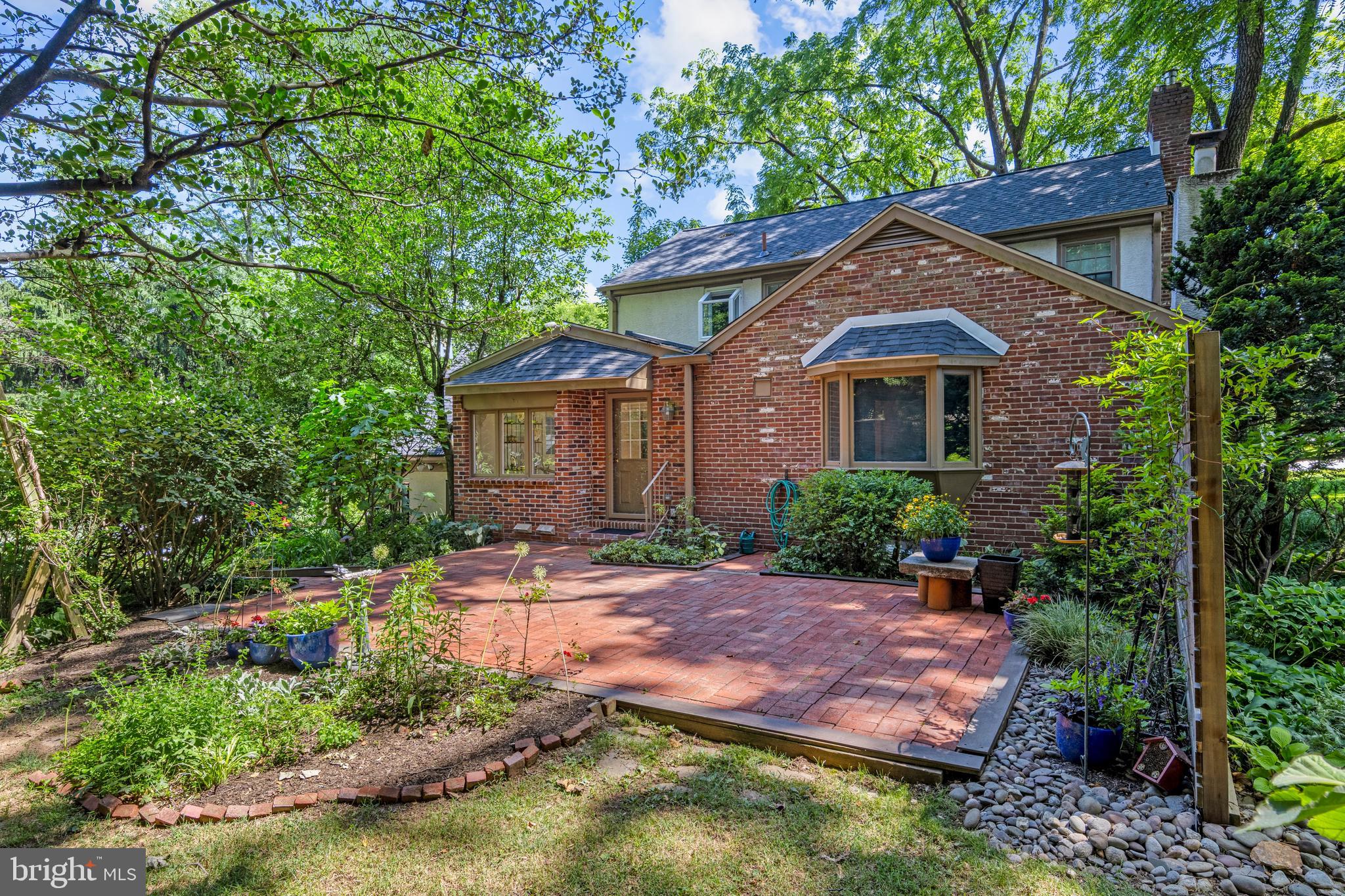 931 Hollow Road Wayne, PA 19087 - Photo 34 of 41 a backyard of a house with yard and outdoor seating