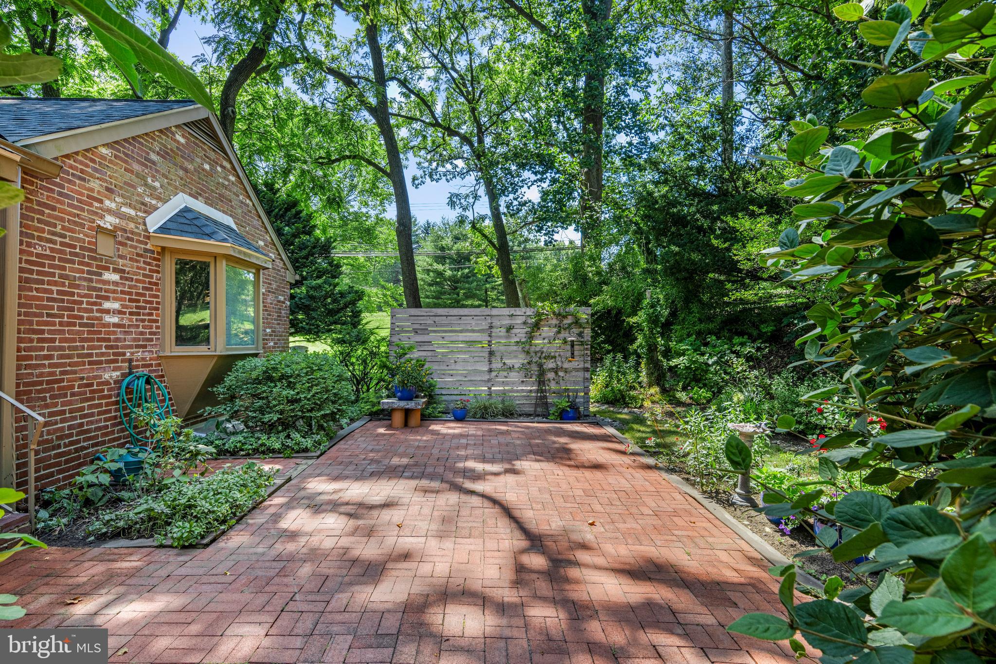 931 Hollow Road Wayne, PA 19087 - Photo 35 of 41 a view of a backyard with plants and large trees