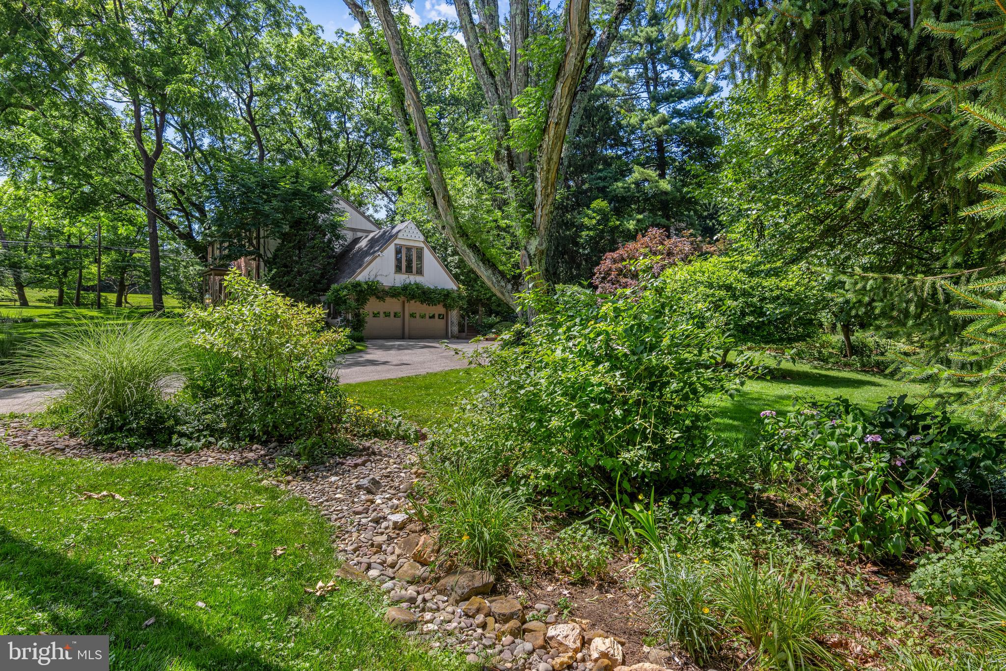931 Hollow Road Wayne, PA 19087 - Photo 38 of 41 a aerial view of a house with a yard and large trees