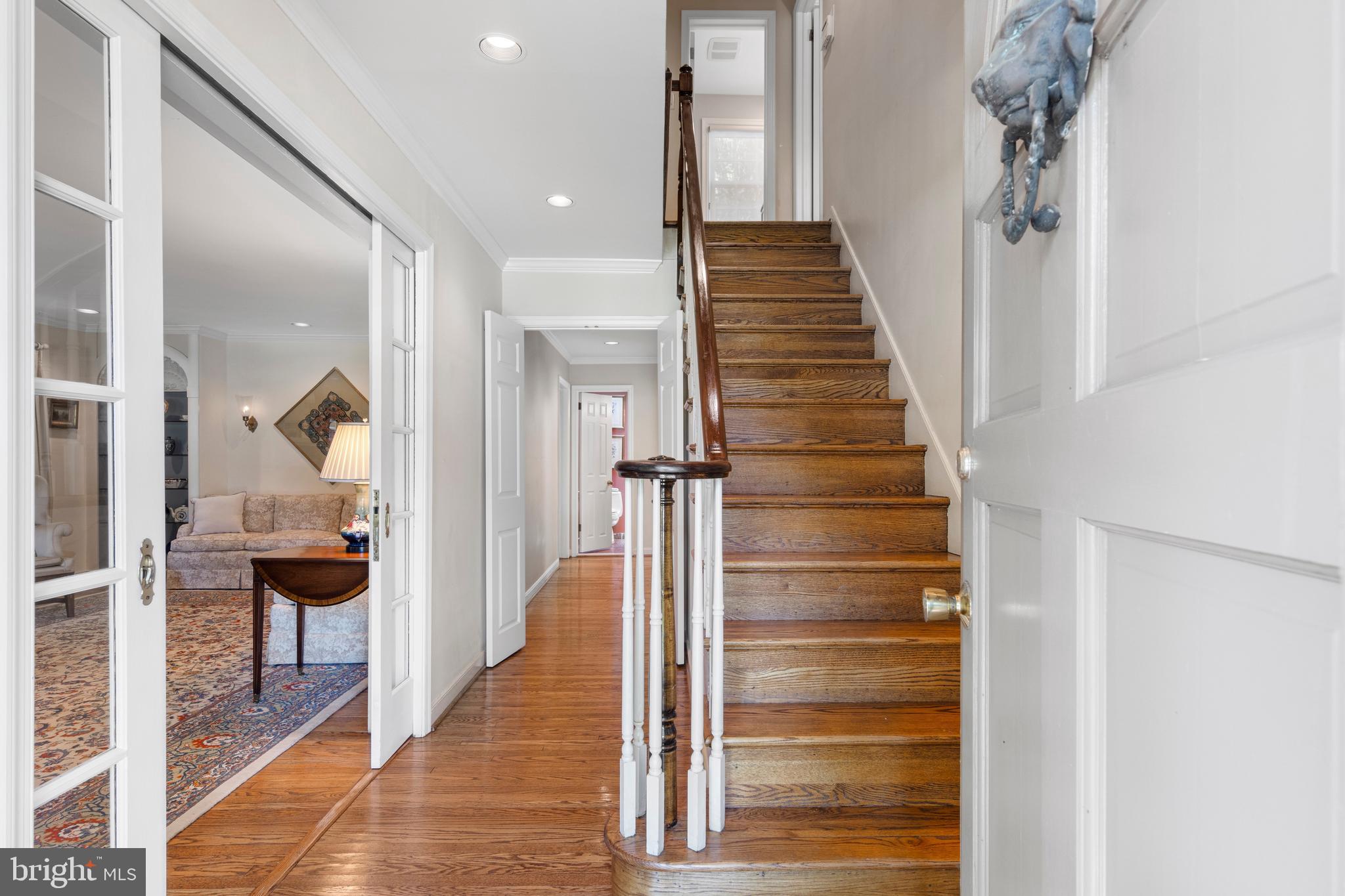 931 Hollow Road Wayne, PA 19087 - Photo 4 of 41 a view of a hallway with wooden floor and windows