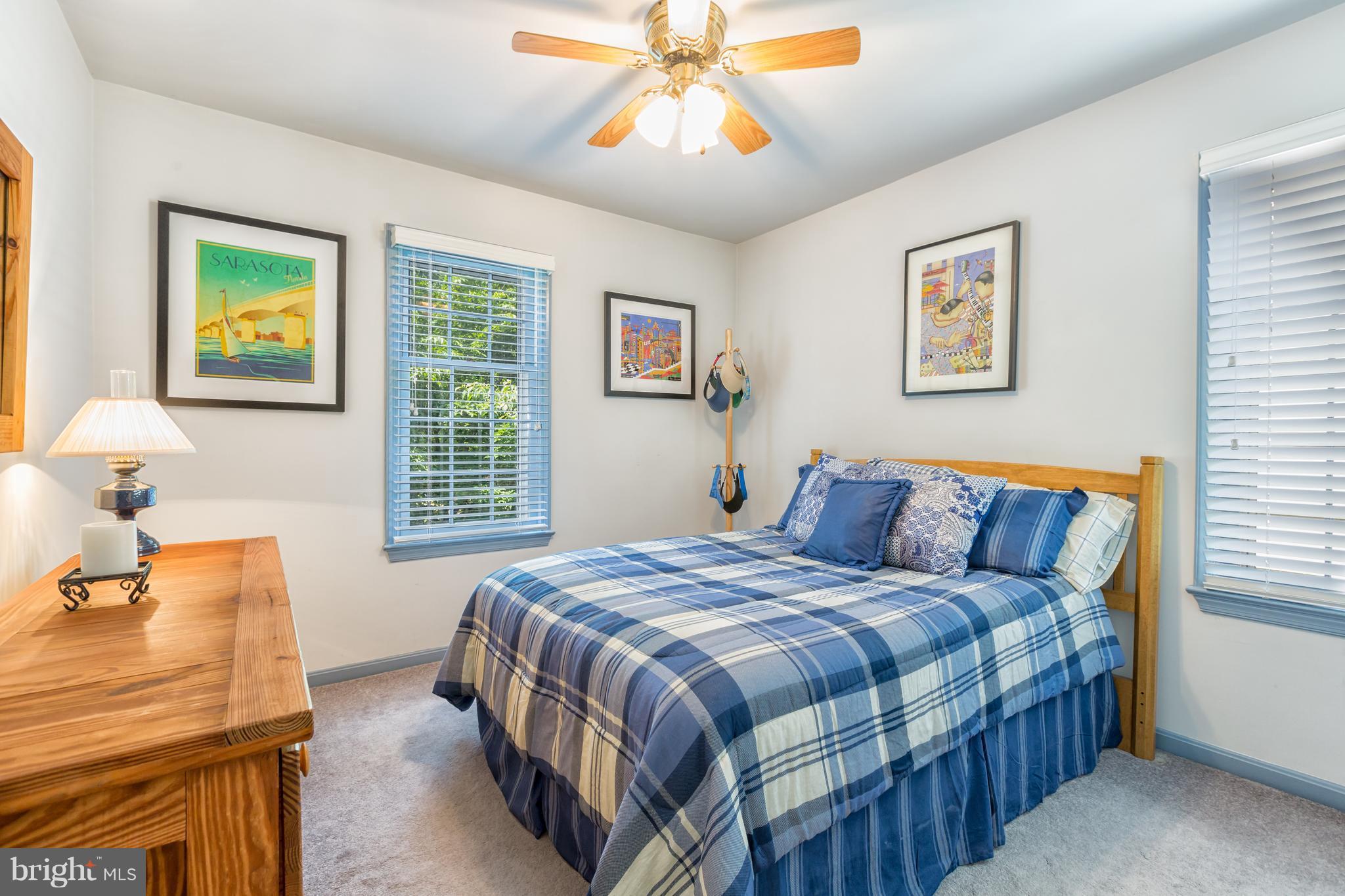 2102 Salt Kettle Way Reston, VA 20191 - Photo 11 of 22 a bedroom with a bed and a chandelier