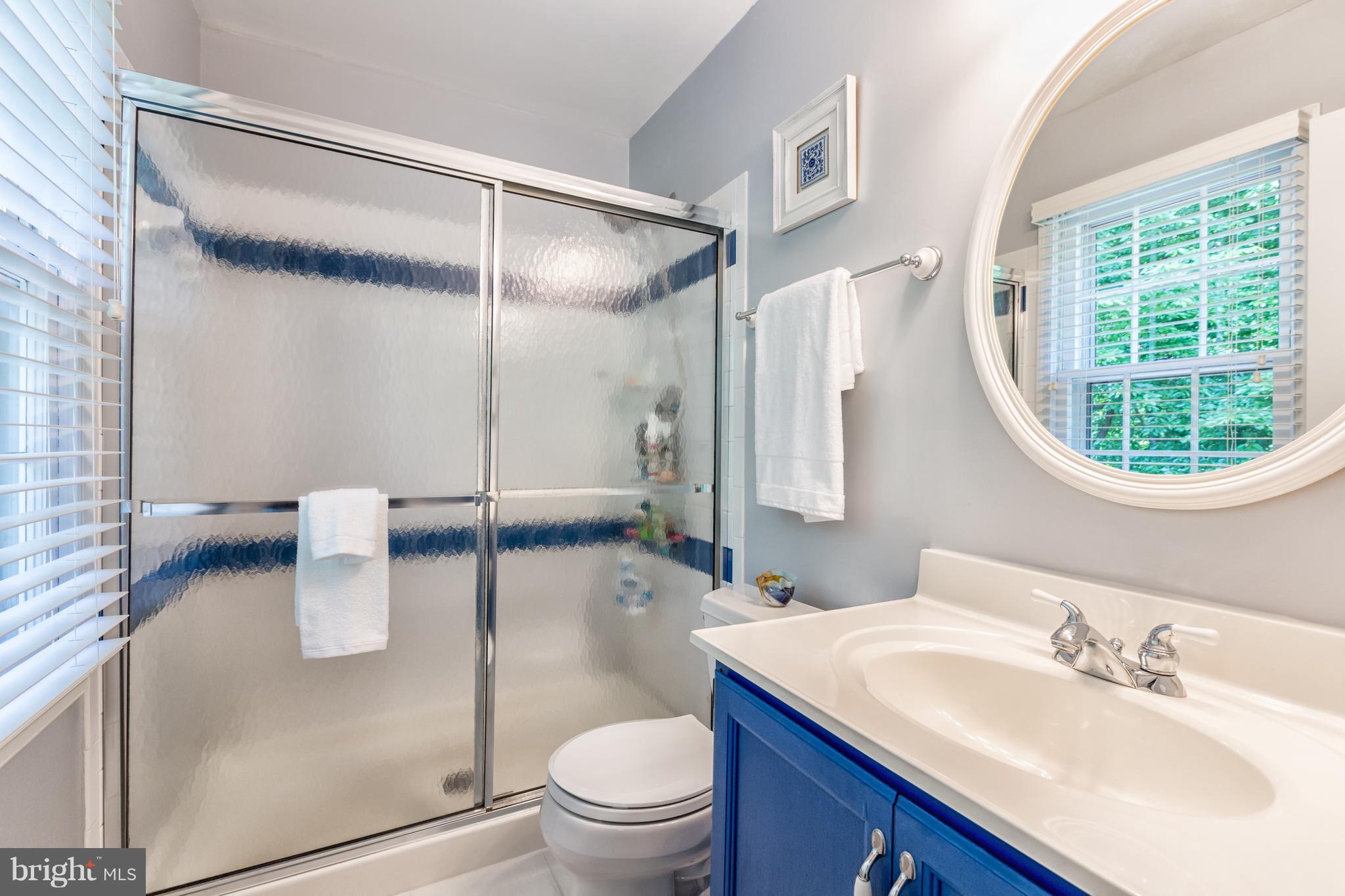 2102 Salt Kettle Way Reston, VA 20191 - Photo 13 of 22 a bathroom with a sink a toilet and a mirror