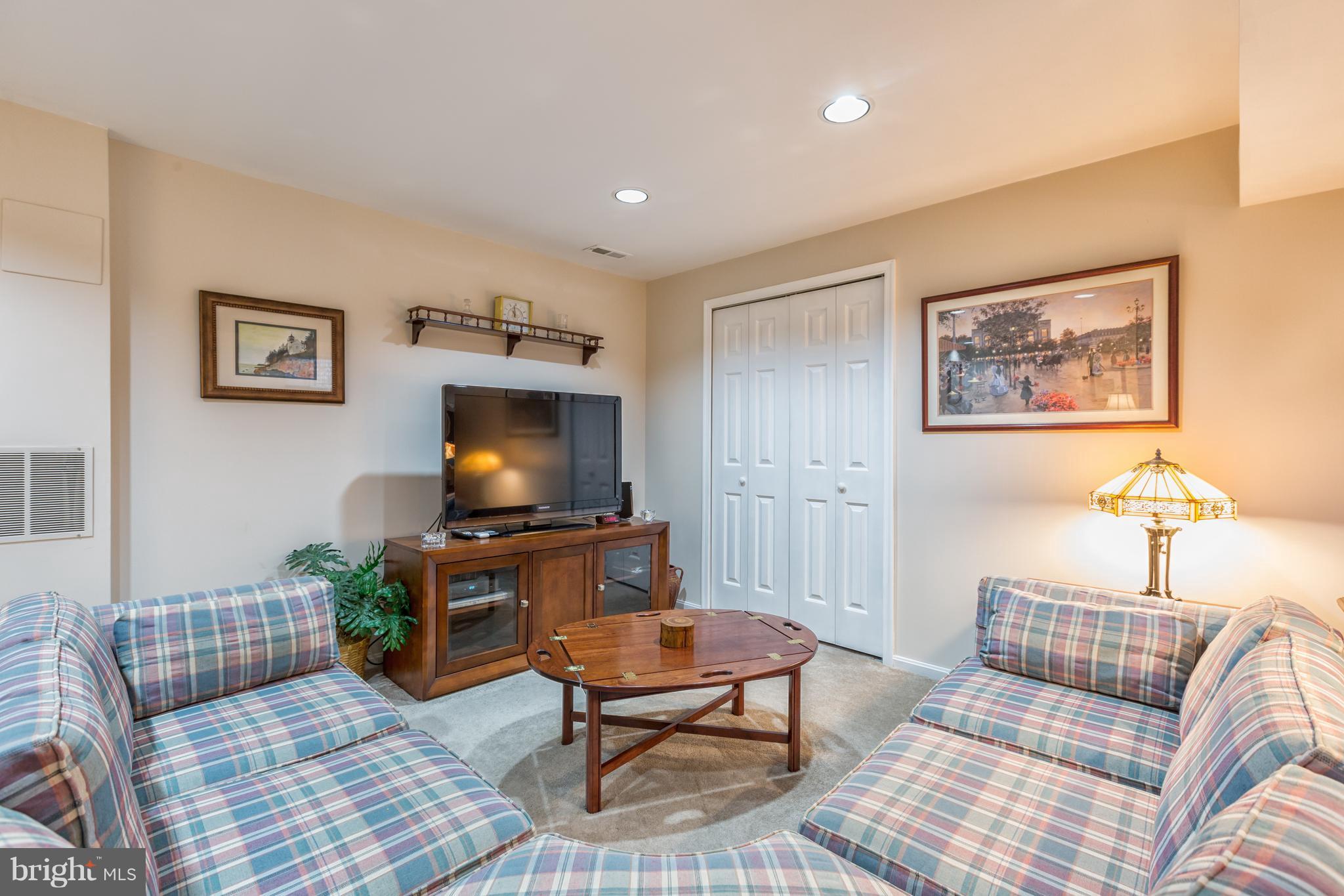 2102 Salt Kettle Way Reston, VA 20191 - Photo 14 of 22 a living room with furniture and a flat screen tv