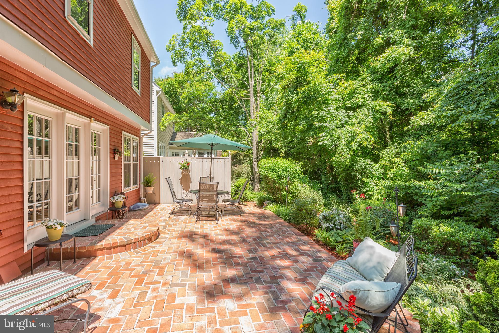 2102 Salt Kettle Way Reston, VA 20191 - Photo 19 of 22 a view of a patio with table and chairs and potted plants
