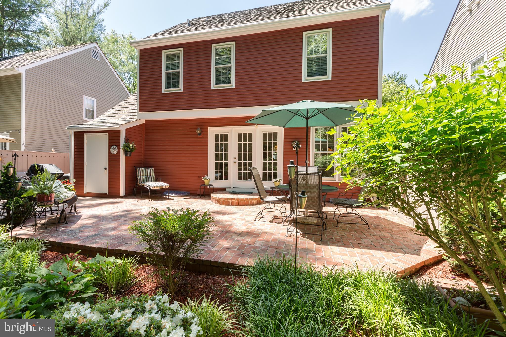 2102 Salt Kettle Way Reston, VA 20191 - Photo 22 of 22 a backyard of a house with yard and outdoor seating