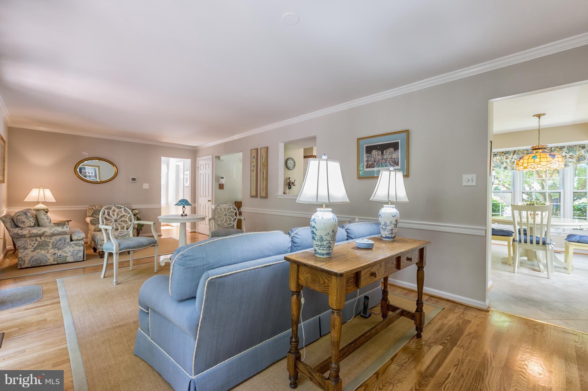 2102 Salt Kettle Way Reston, VA 20191 - Photo 4 of 22 a living room with furniture a wooden floor and next to a window