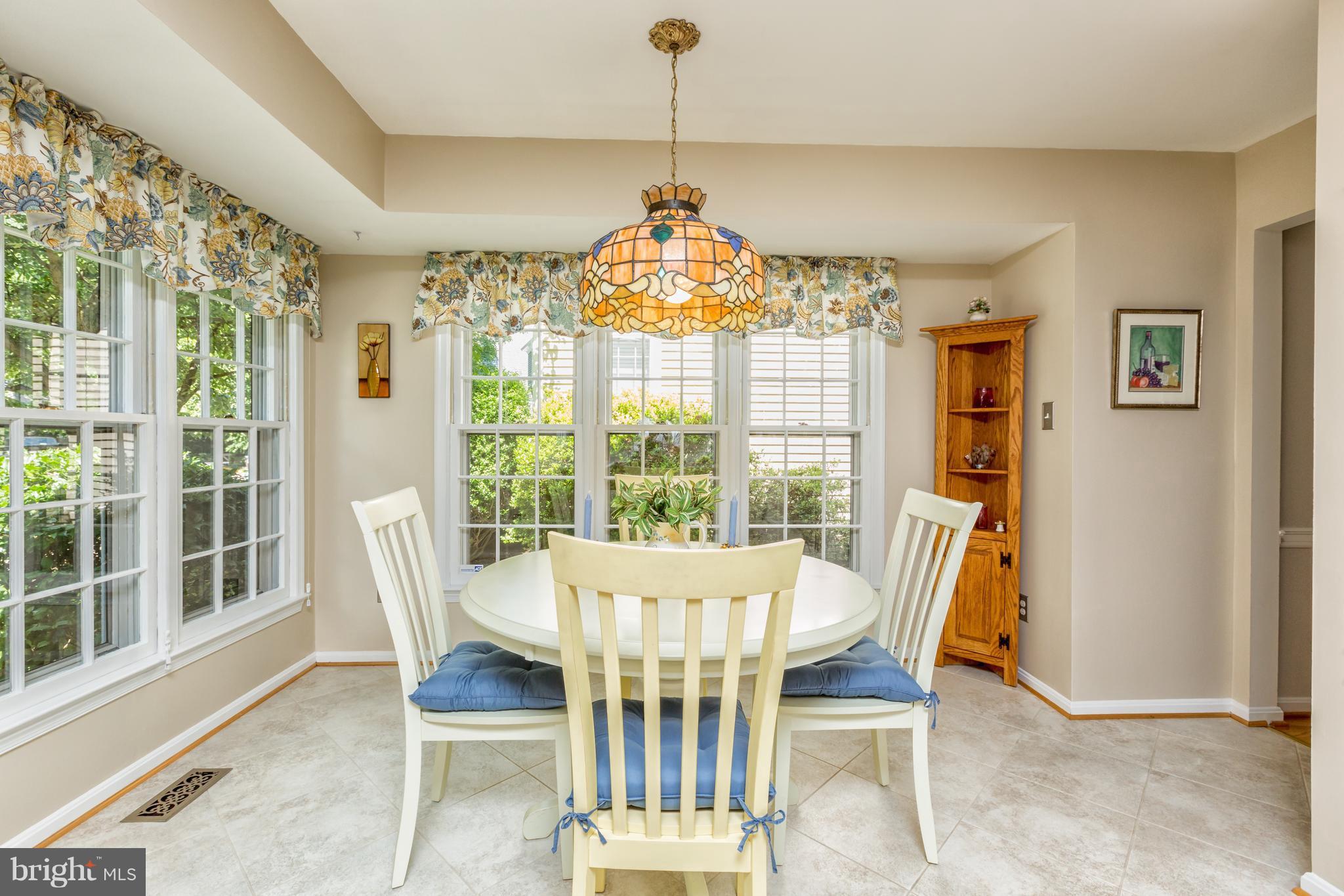 2102 Salt Kettle Way Reston, VA 20191 - Photo 7 of 22 a view of a dining room with furniture window and outside view