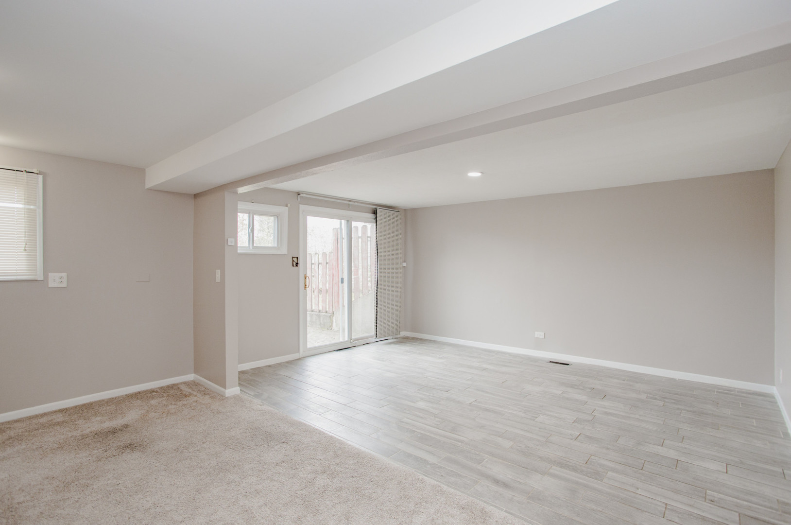 720 Durham Lane Hoffman Estates, IL 60169 - Photo 16 of 32 wooden floor in an empty room with a window
