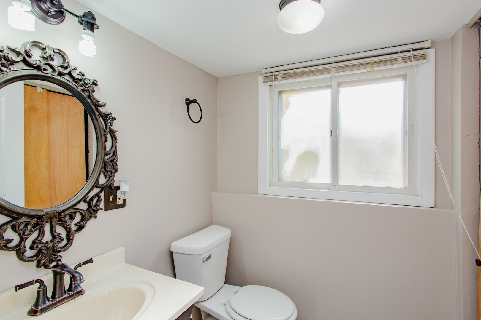 720 Durham Lane Hoffman Estates, IL 60169 - Photo 18 of 32 a bathroom with a toilet mirror and vanity