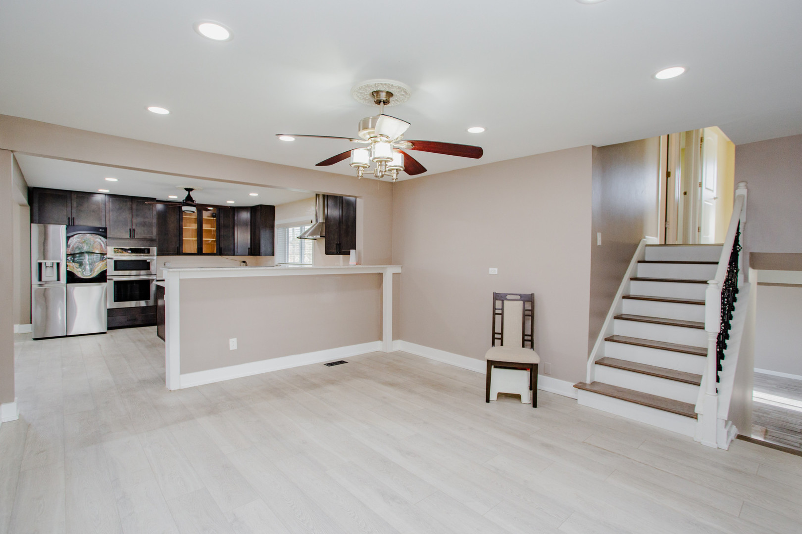 720 Durham Lane Hoffman Estates, IL 60169 - Photo 5 of 32 a view of an empty room with kitchen and a window