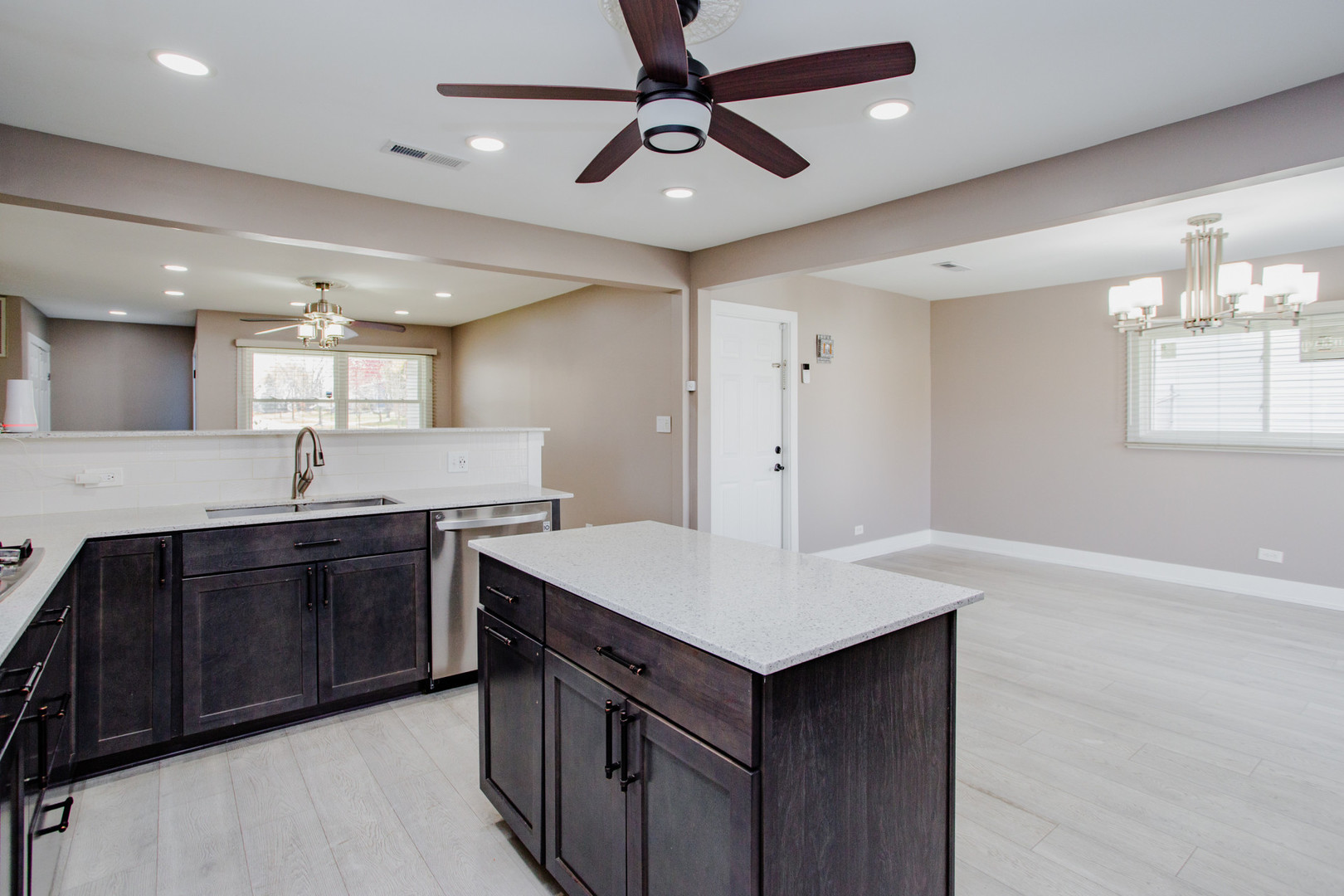720 Durham Lane Hoffman Estates, IL 60169 - Photo 10 of 32 a kitchen with sink cabinets and chandelier
