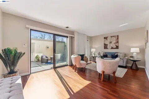 a living room with furniture a fireplace and a table