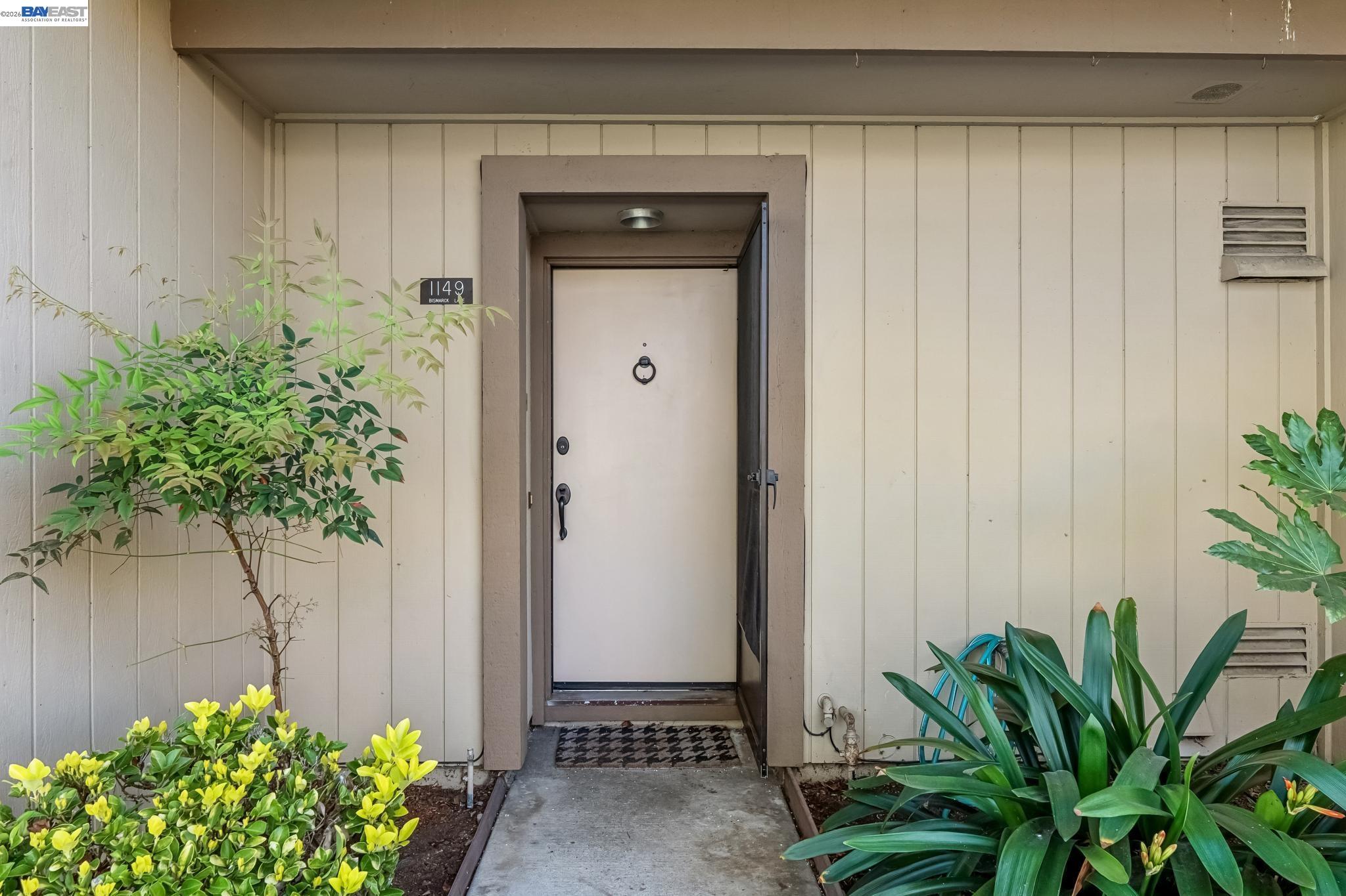 1149 Bismarck Lane Alameda, CA 94502 - Photo 2 of 57 a view of a potted plant in front of a door