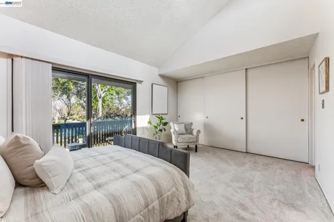 a bedroom with a bed and a cabinets