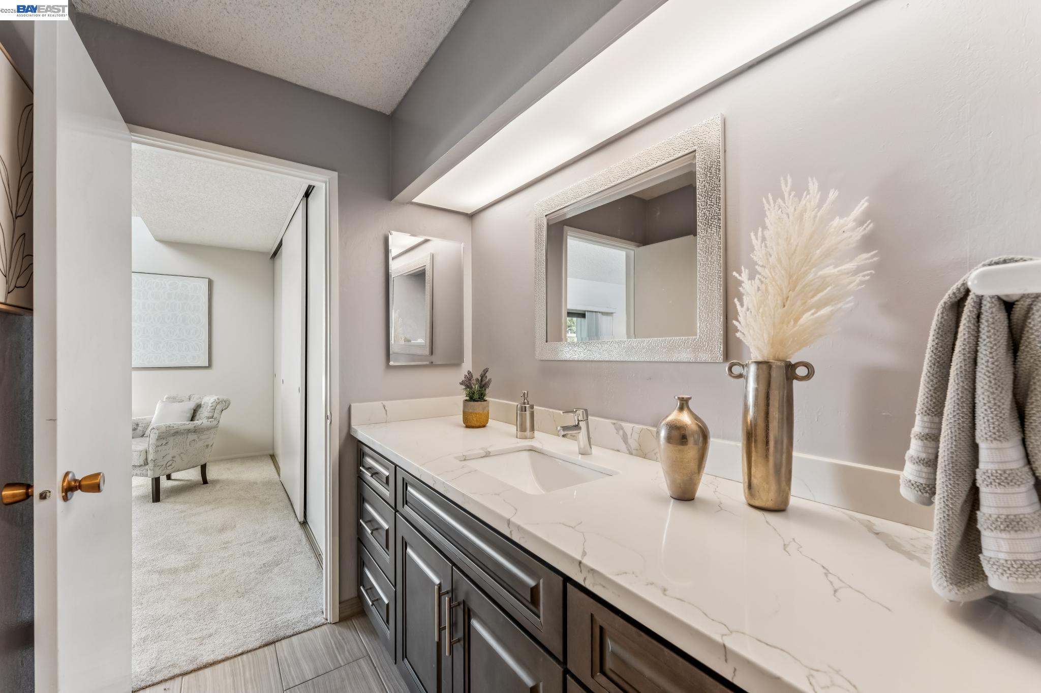 1149 Bismarck Lane Alameda, CA 94502 - Photo 25 of 57 a en suite bathroom with a sink and a mirror
