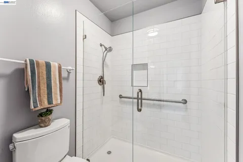 a balcony view with a potted plant