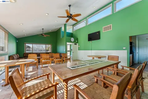 a view of a sign board with flower plants