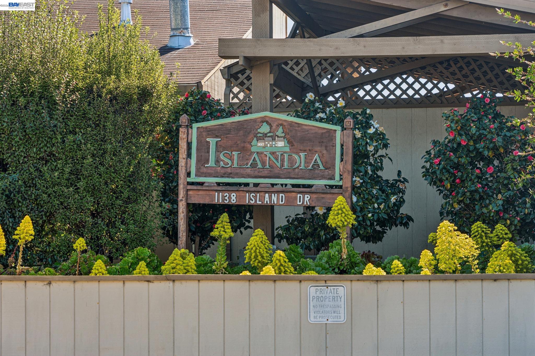 1149 Bismarck Lane Alameda, CA 94502 - Photo 55 of 57 a view of a sign board with flower plants