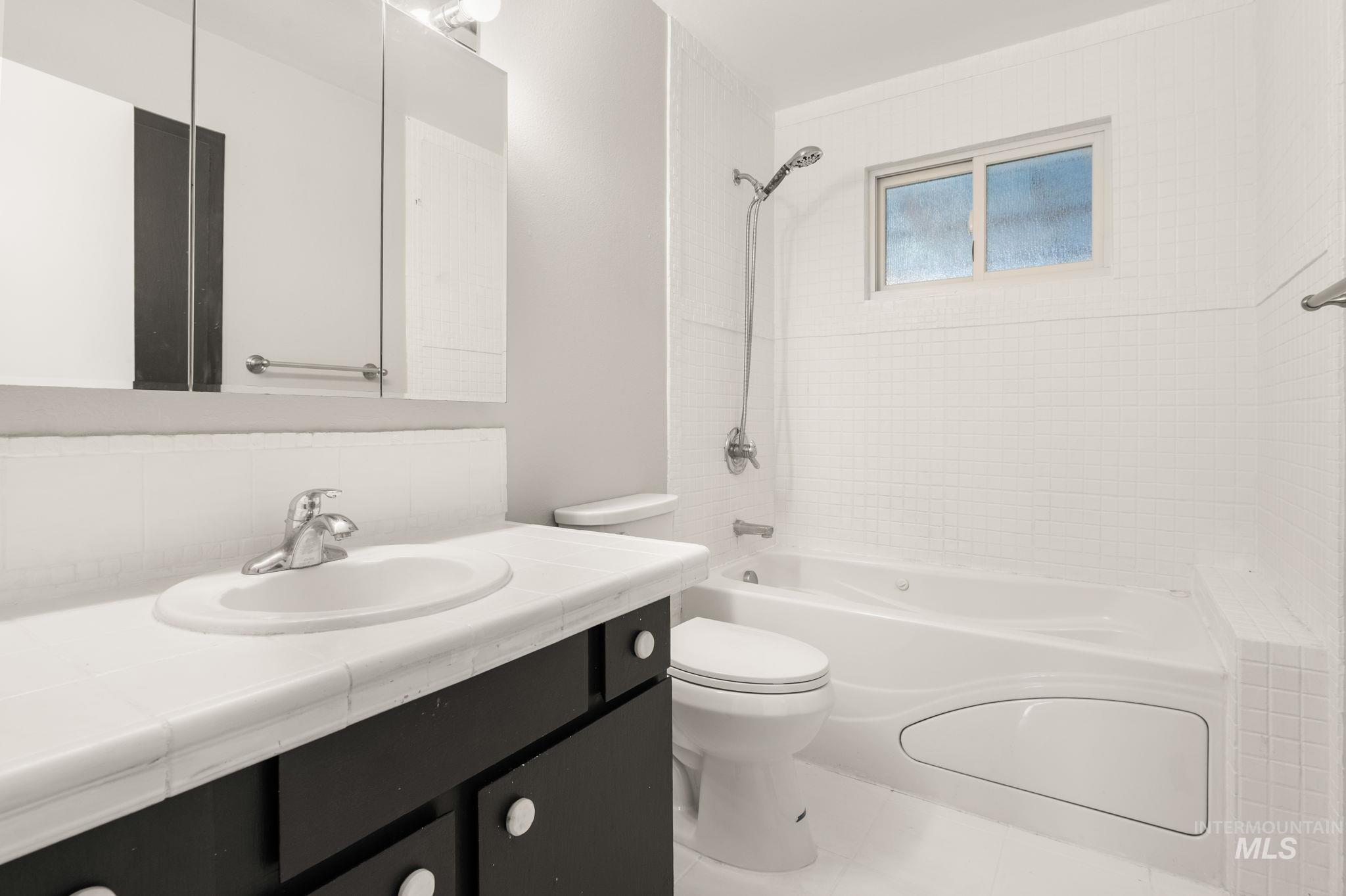 2351 Reservoir Road Clarkston, WA 99403 - Photo 12 of 24 Full bath with shower combination, vanity, and tile patterned flooring