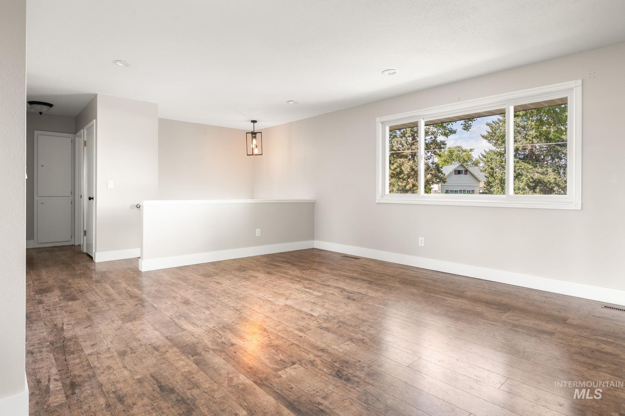 2351 Reservoir Road Clarkston, WA 99403 - Photo 5 of 24 Spare room featuring wood finished floors and baseboards