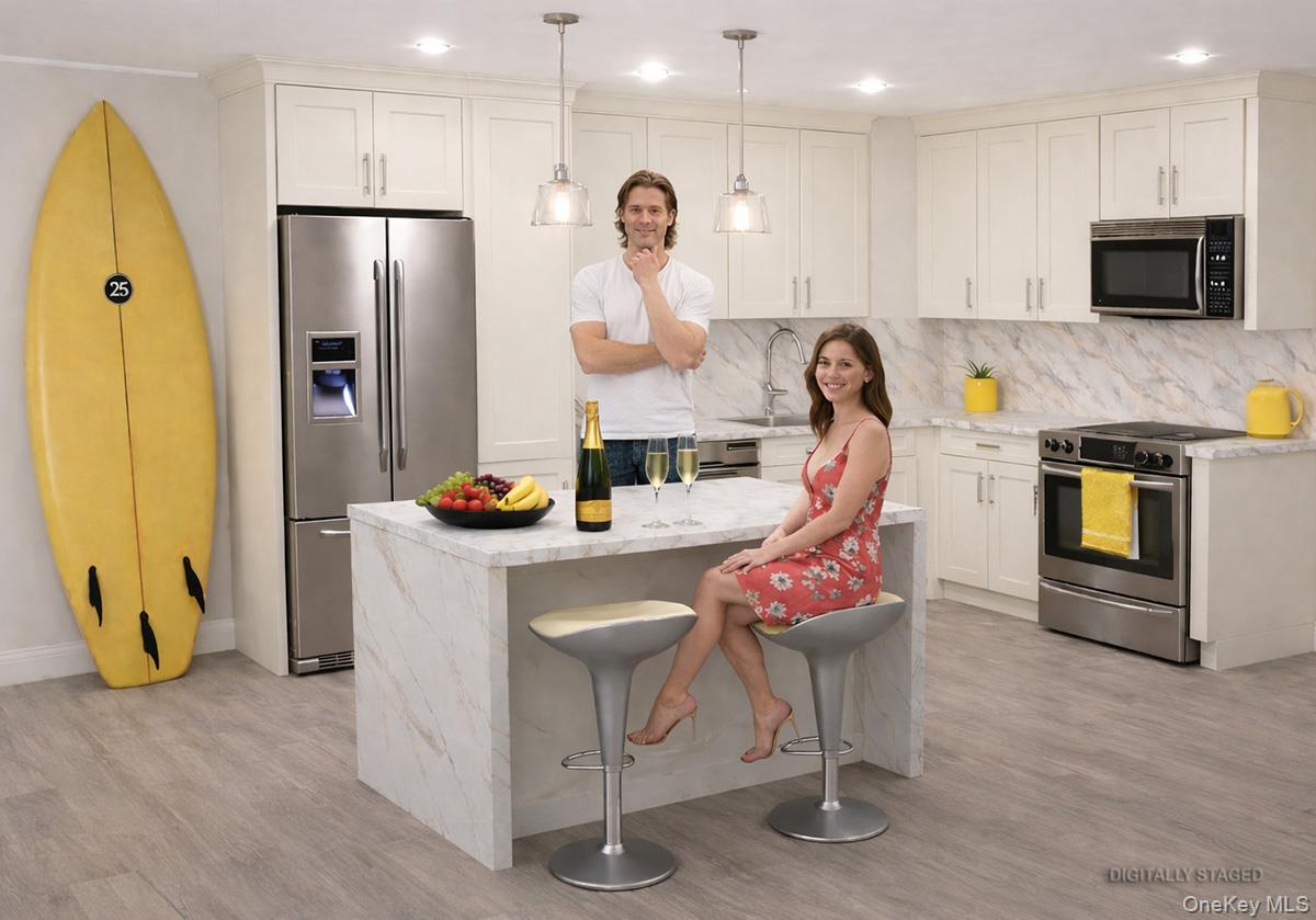 360 Shore Road, Unit 9C Long Beach, NY 11561 - Photo 8 of 17 New Kitchen Digital Rendering based on the design plans. The people in this photo are digitally created. The real photos will be available in May after the construction if finished.