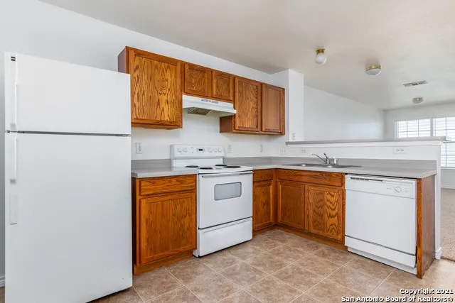 a kitchen with stainless steel appliances granite countertop a stove and a sink