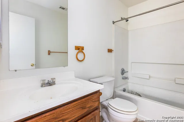 an empty room with a empty space and windows