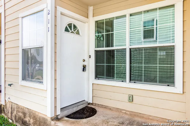 a view of a door and a window