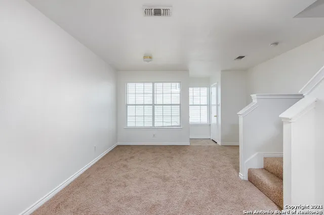 a kitchen with a stove a sink and a refrigerator