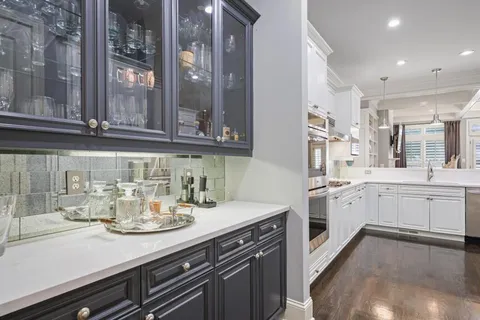 a kitchen with a sink and cabinets