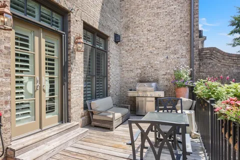 a balcony view with a seating space