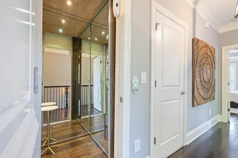 a bathroom with a mirror and a shower