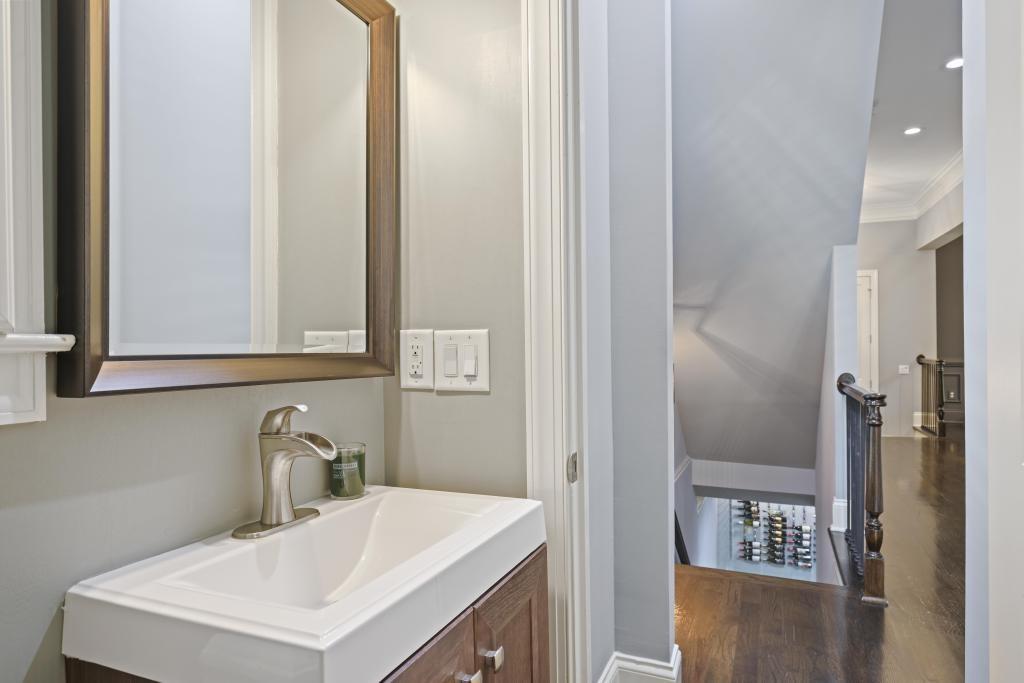 3601 Habersham Road Northwest Atlanta, GA 30305 - Photo 15 of 34 a bathroom with a sink and a mirror