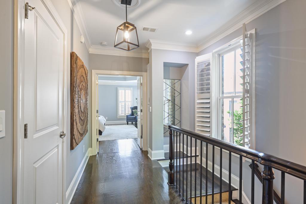 3601 Habersham Road Northwest Atlanta, GA 30305 - Photo 16 of 34 a view of a hallway view with living room and wooden floor