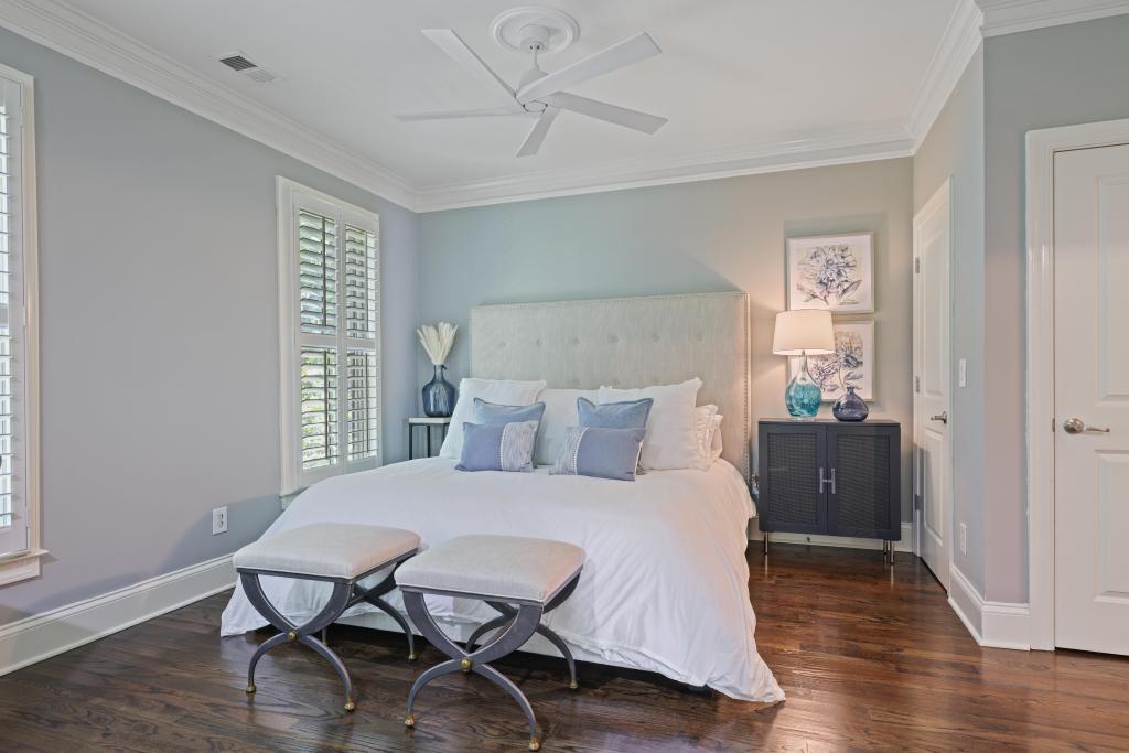 3601 Habersham Road Northwest Atlanta, GA 30305 - Photo 17 of 34 a bedroom with a bed and wooden floor