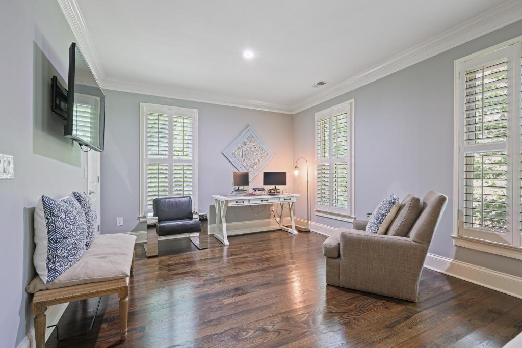 3601 Habersham Road Northwest Atlanta, GA 30305 - Photo 19 of 34 a living room with furniture and a flat screen tv