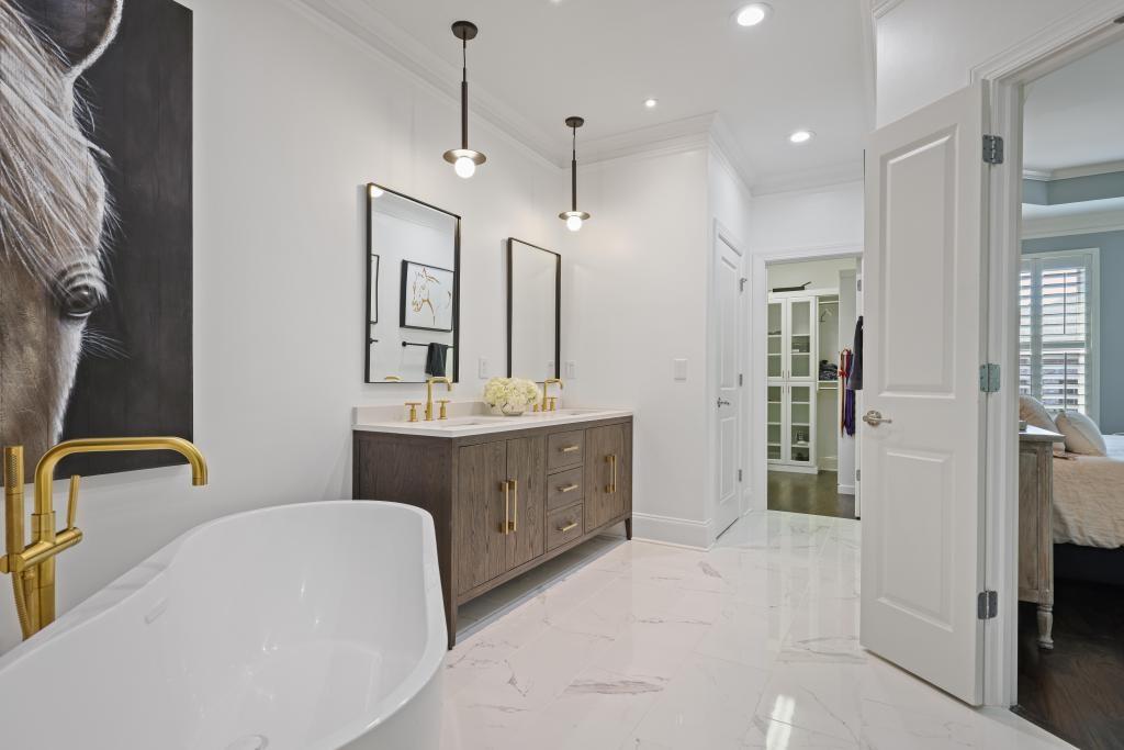3601 Habersham Road Northwest Atlanta, GA 30305 - Photo 22 of 34 a bathroom with a double vanity sink mirror and shower