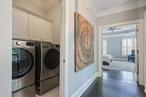 a view of a hallway with washer and dryer